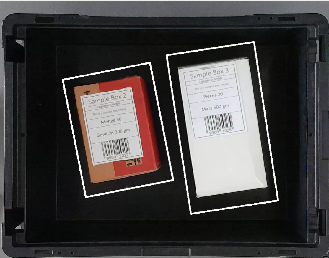Boxes with barcode in totes on a conveyor